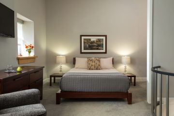 Deluxe Full Service Suite Bedroom