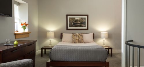 Deluxe Full Service Suite Bedroom